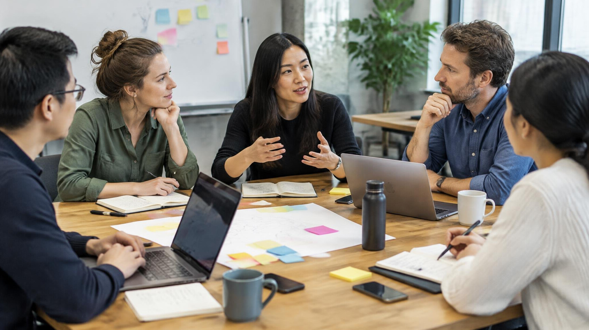 Group of colleagues in a workshop around a table