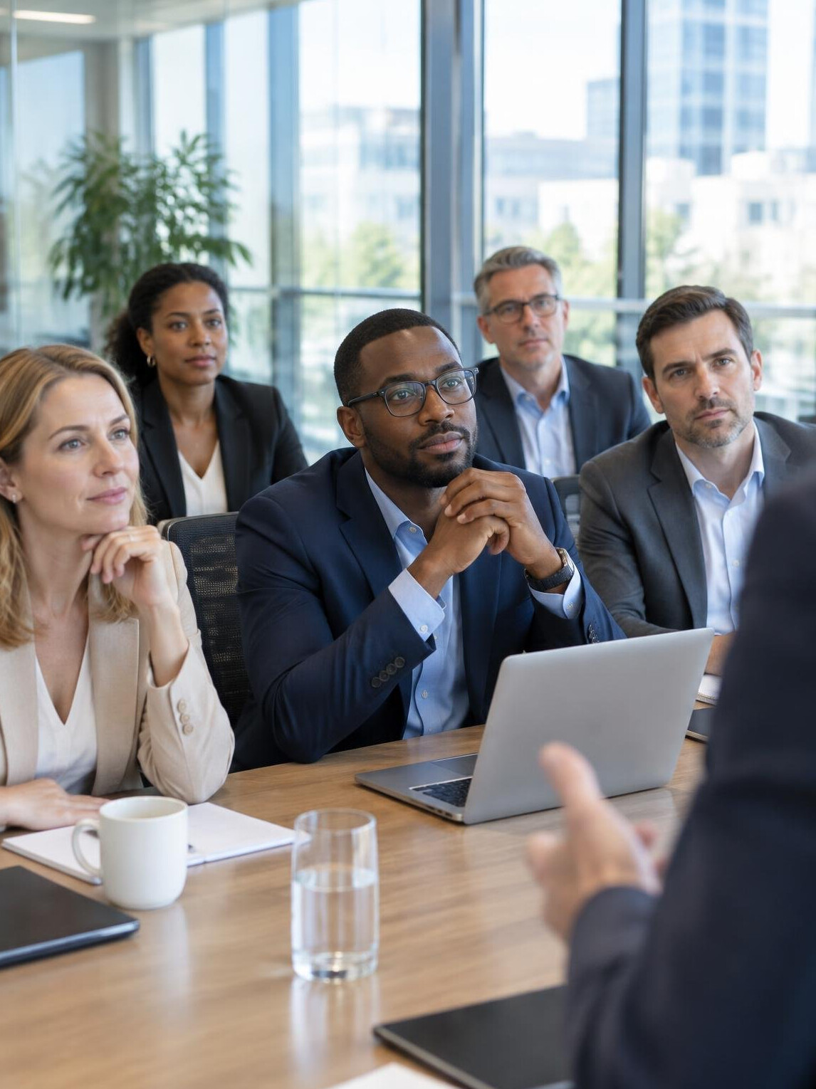 Professionals listening in a business meeting
